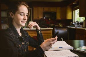 Teenager studying at home